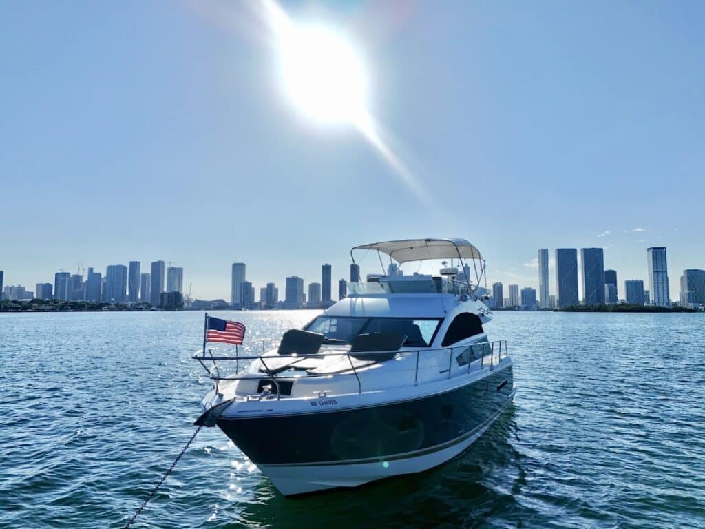 Yacht with miami skyline behind