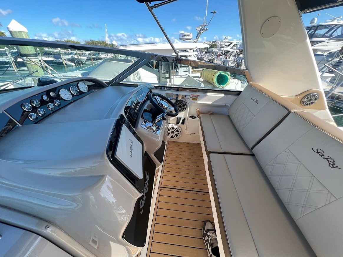 Helm and cockpit of the 40 Sea Ray yacht with Garmin chartplotter and full instrument panel, docked at Miami marina
