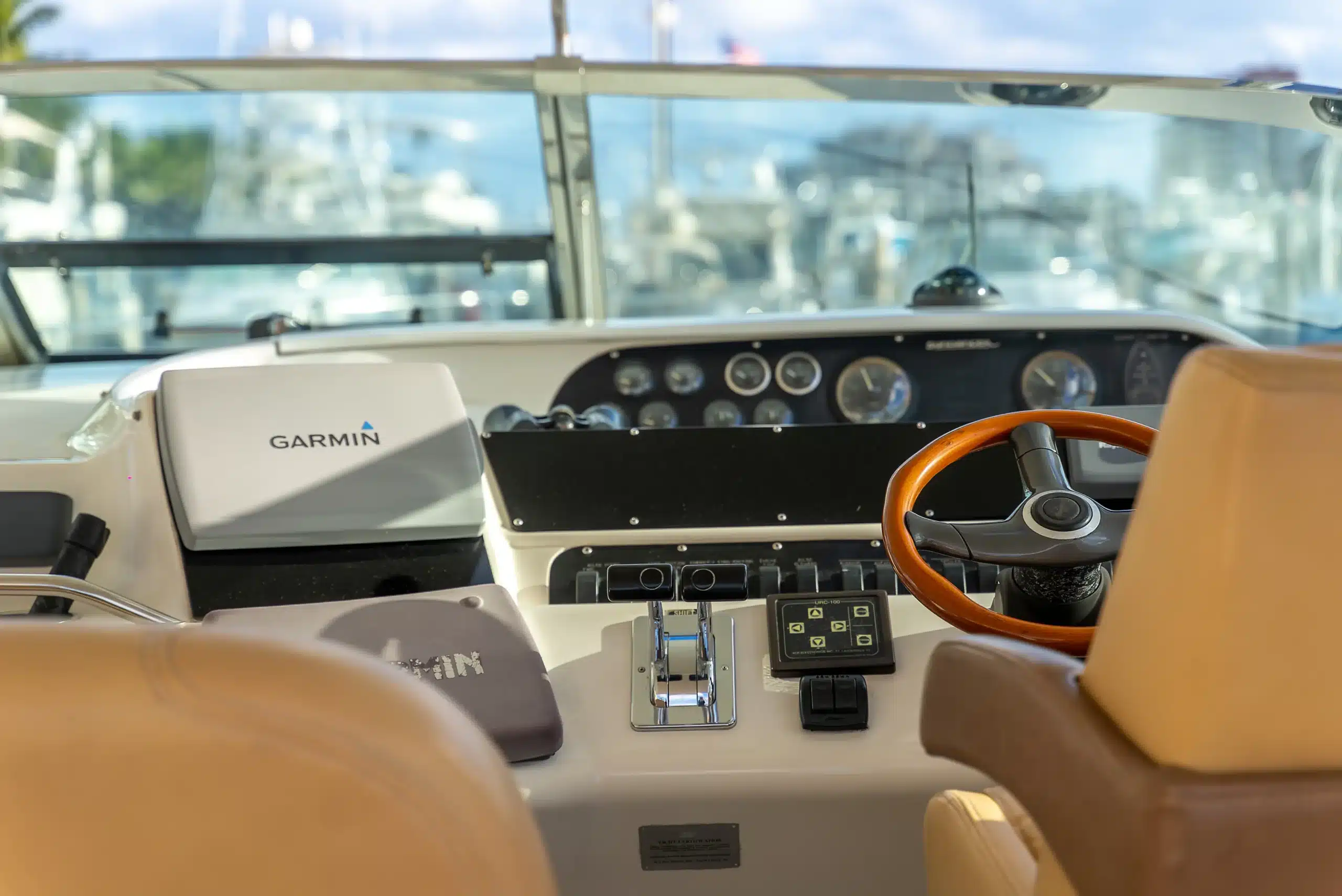Helm station on the 48 Sundancer sport yacht — shot from behind the wheel, Miami charter