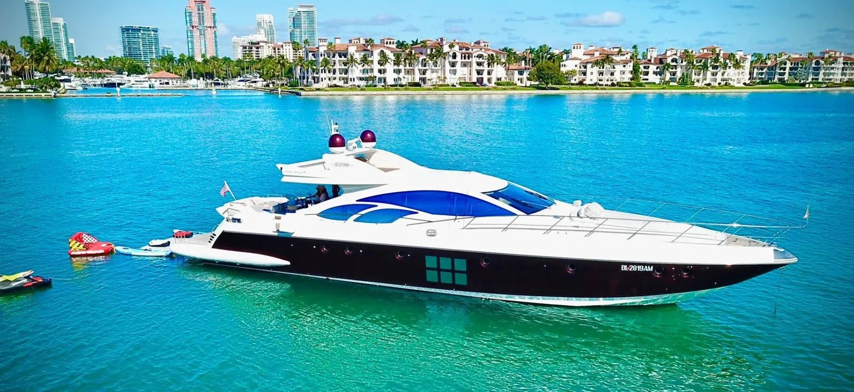 Profile of the 62 Azimut on Government Cut with Miami skyline
