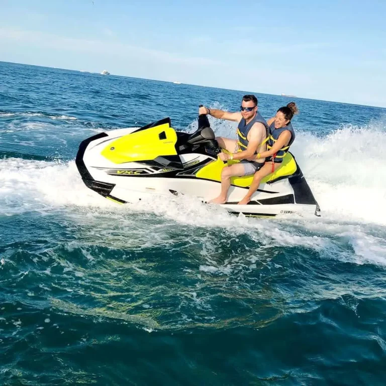 Guests on a Yamaha jet ski cruising Biscayne Bay during a guided Miami tour