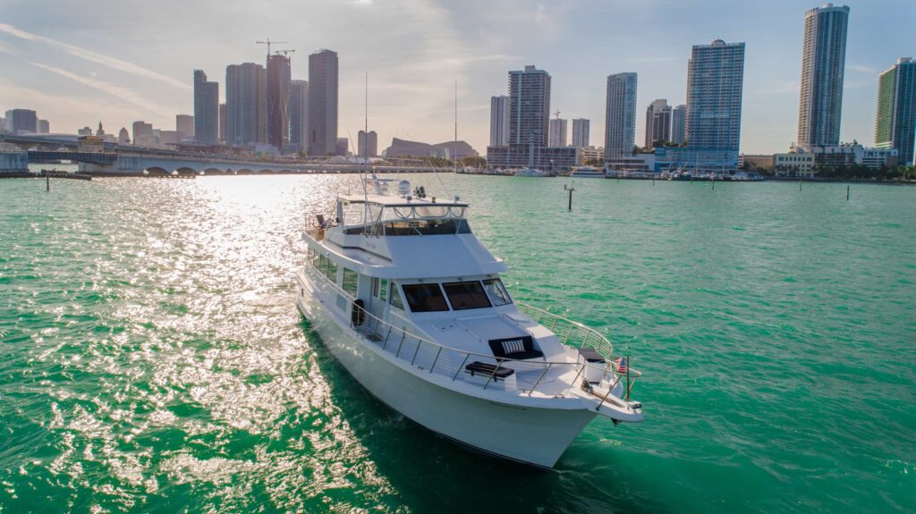 80 ft Solstice yacht cruising Biscayne Bay with the Miami skyline
